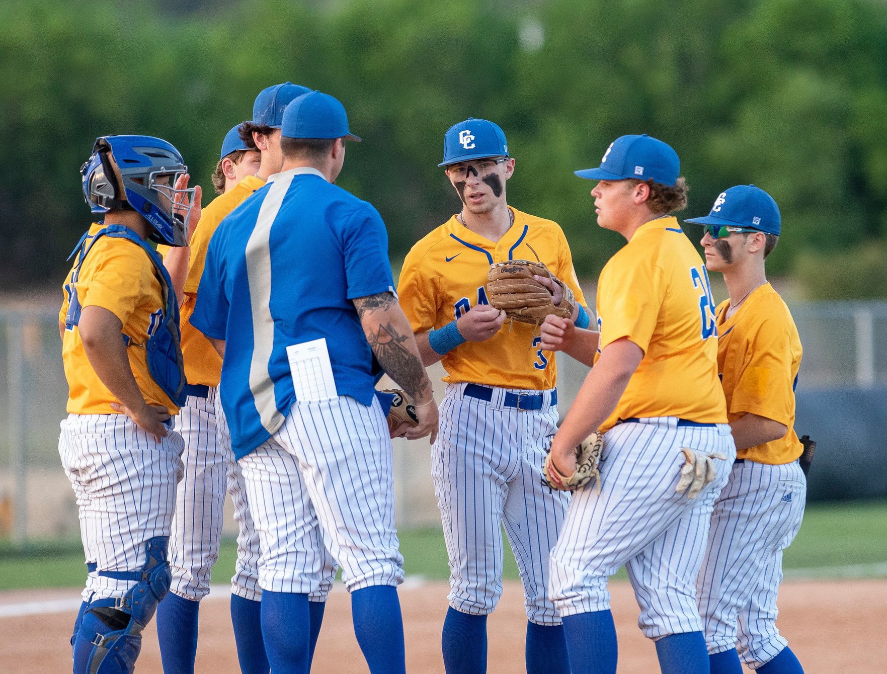 A Team of Baseball Players Having a Conversation 